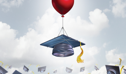 A balloon attached to a graduation cap floats upward into the sky.