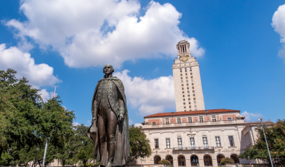 A statue and building on a university campus.