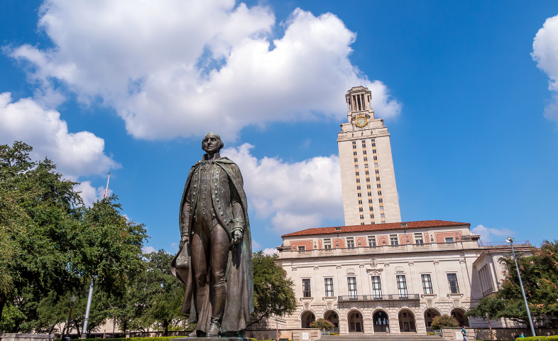 A statue and building on a university campus.