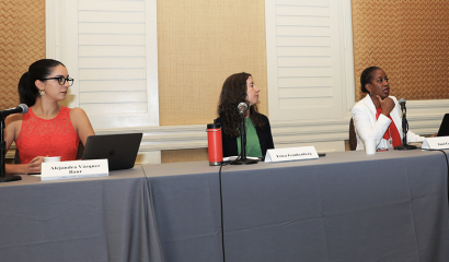 A panel of three women speakers