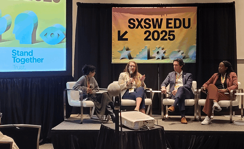 A four-person speaker panel, including one man and three women.