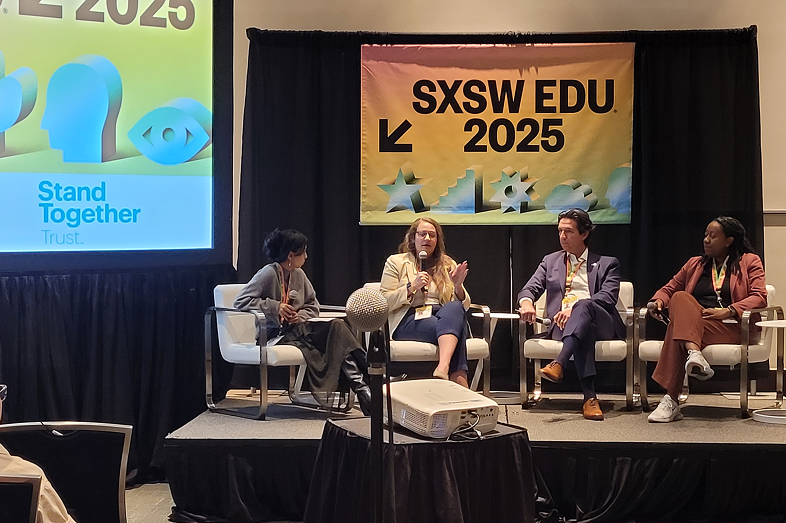 A four-person speaker panel, including one man and three women.