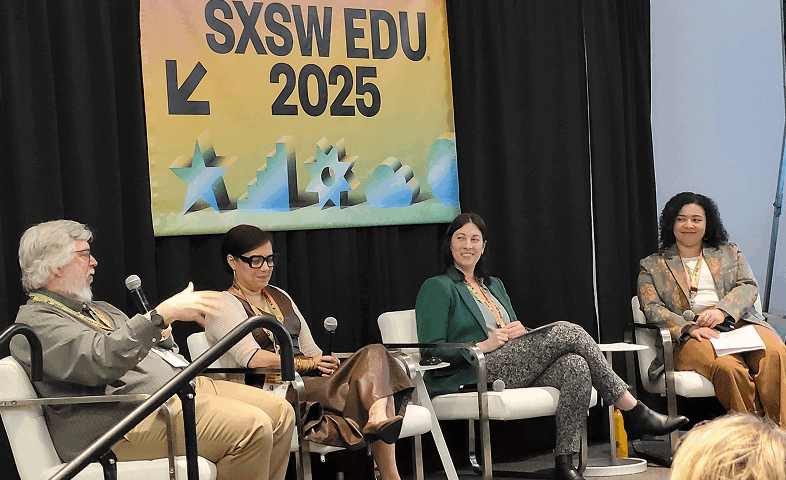 A speaker panel featuring three women and one man.