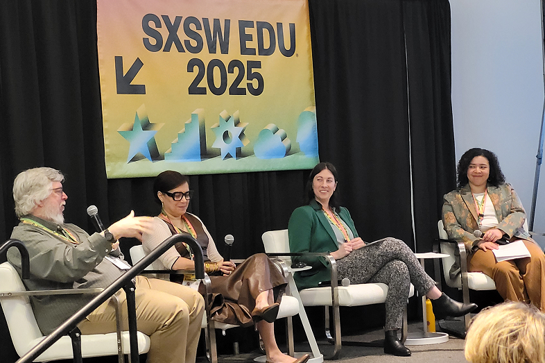 A speaker panel featuring three women and one man.